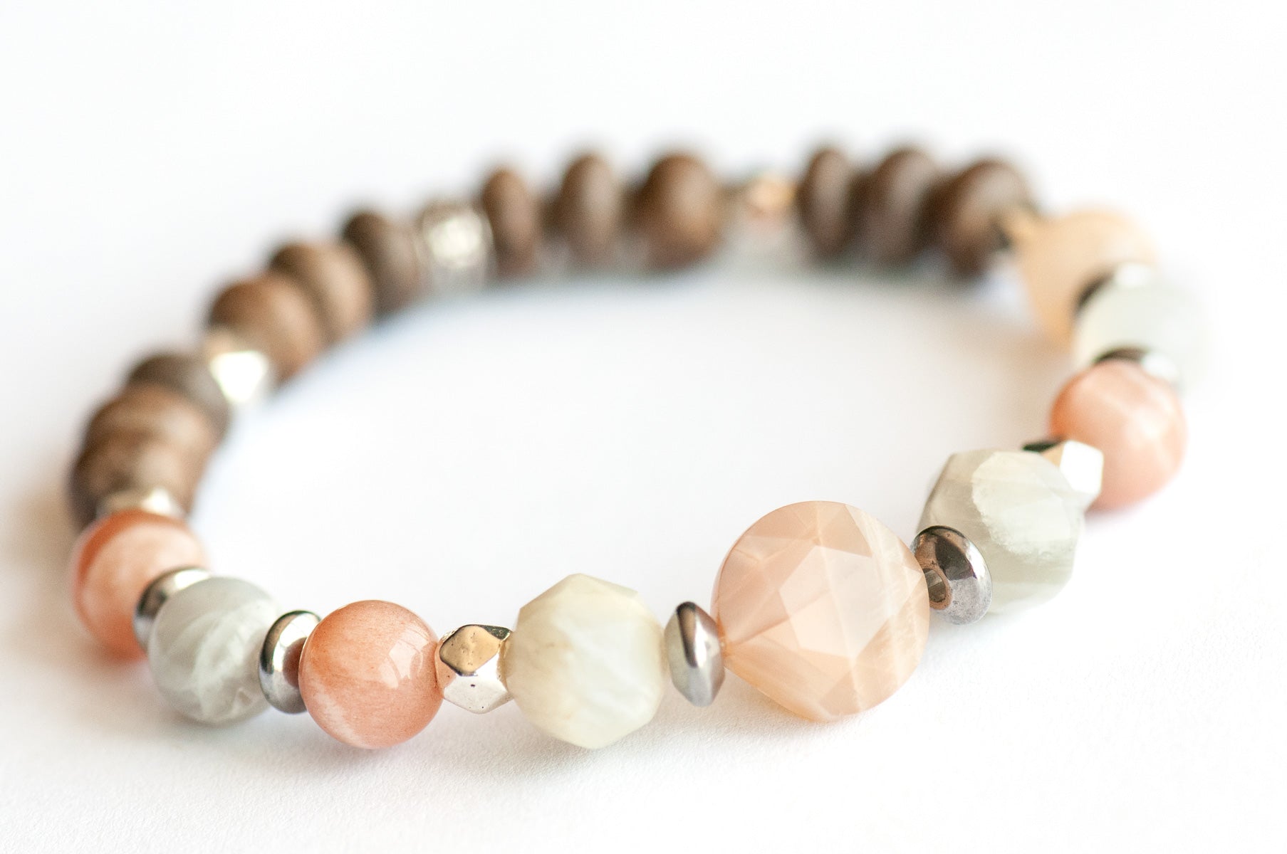 Feature bracelet from Nova Scotia Lynx Set – Mixed Moonstone star-cut coin, rounds, and faceted beads with grey wood rondelles and silver spacers