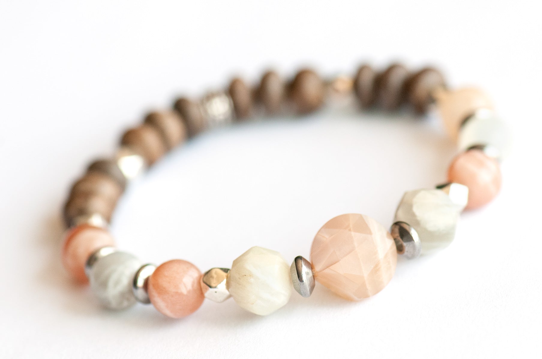 Feature bracelet from Nova Scotia Lynx Set – Mixed Moonstone star-cut coin, rounds, and faceted beads with grey wood rondelles and silver spacers