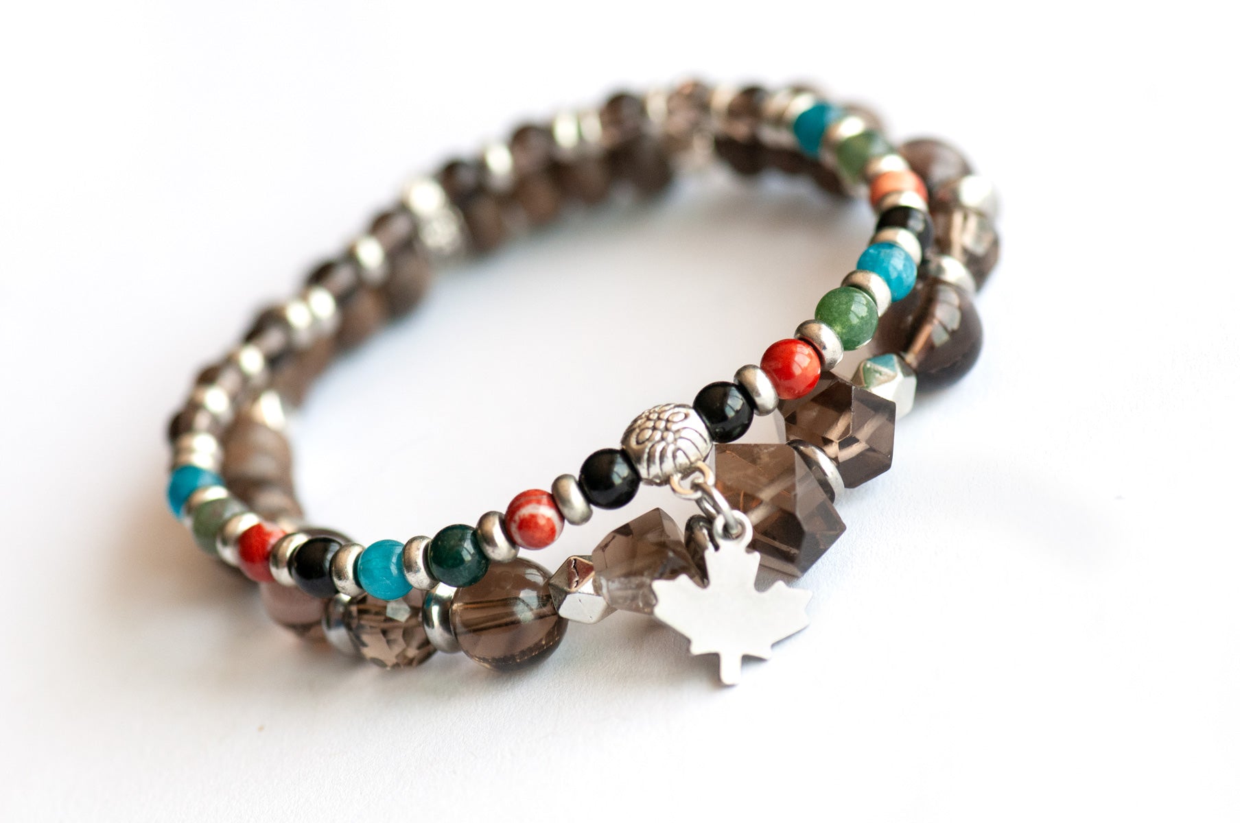 New Brunswick Lynx Bracelet Set – Two coordinating handmade gemstone bracelets with Smoky Quartz, wood beads, and a charm-accented stacker