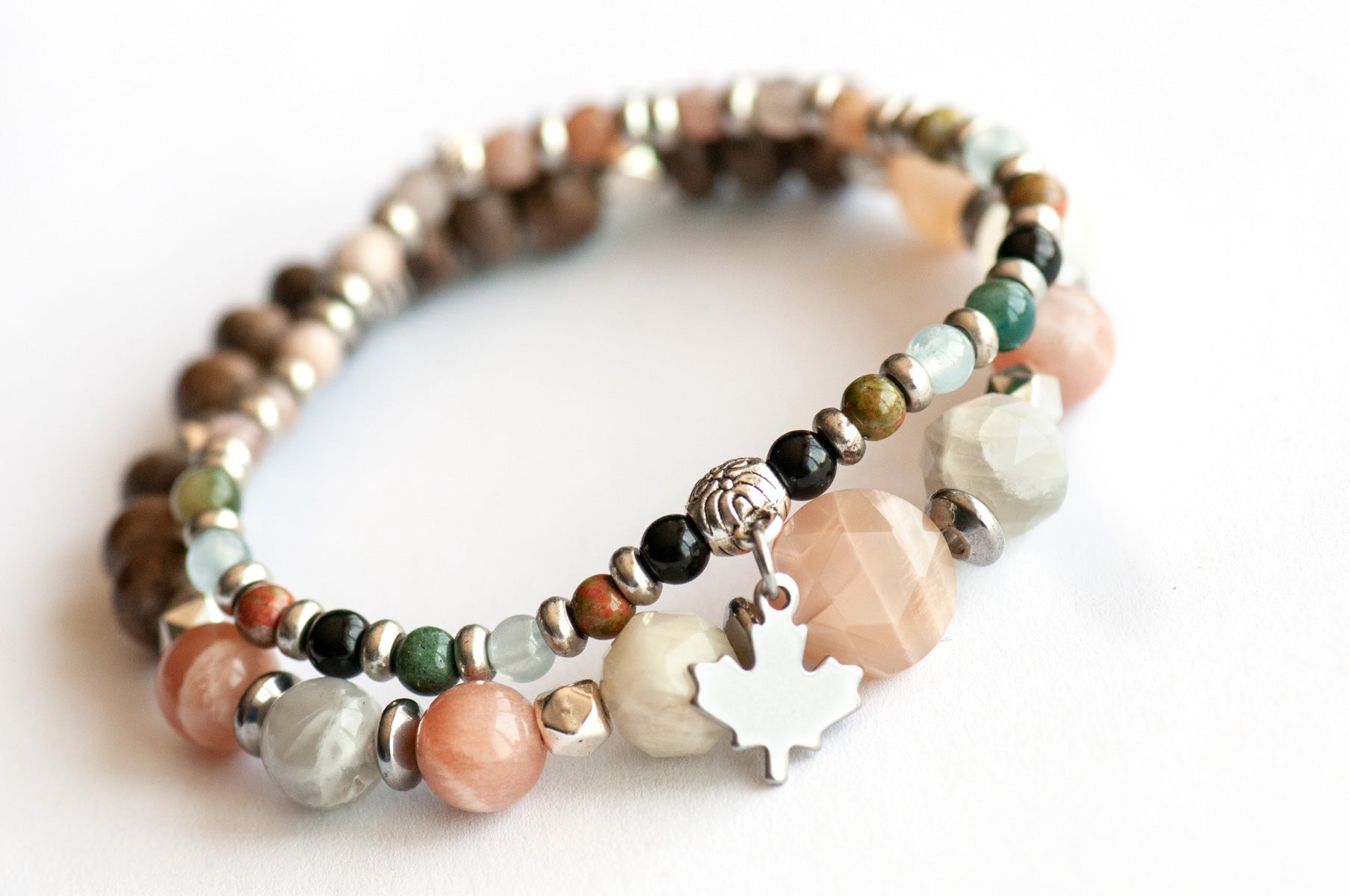 Nova Scotia Lynx Bracelet Set – Two handmade gemstone bracelets featuring Mixed Moonstone, wood beads, and a customizable charm stacker