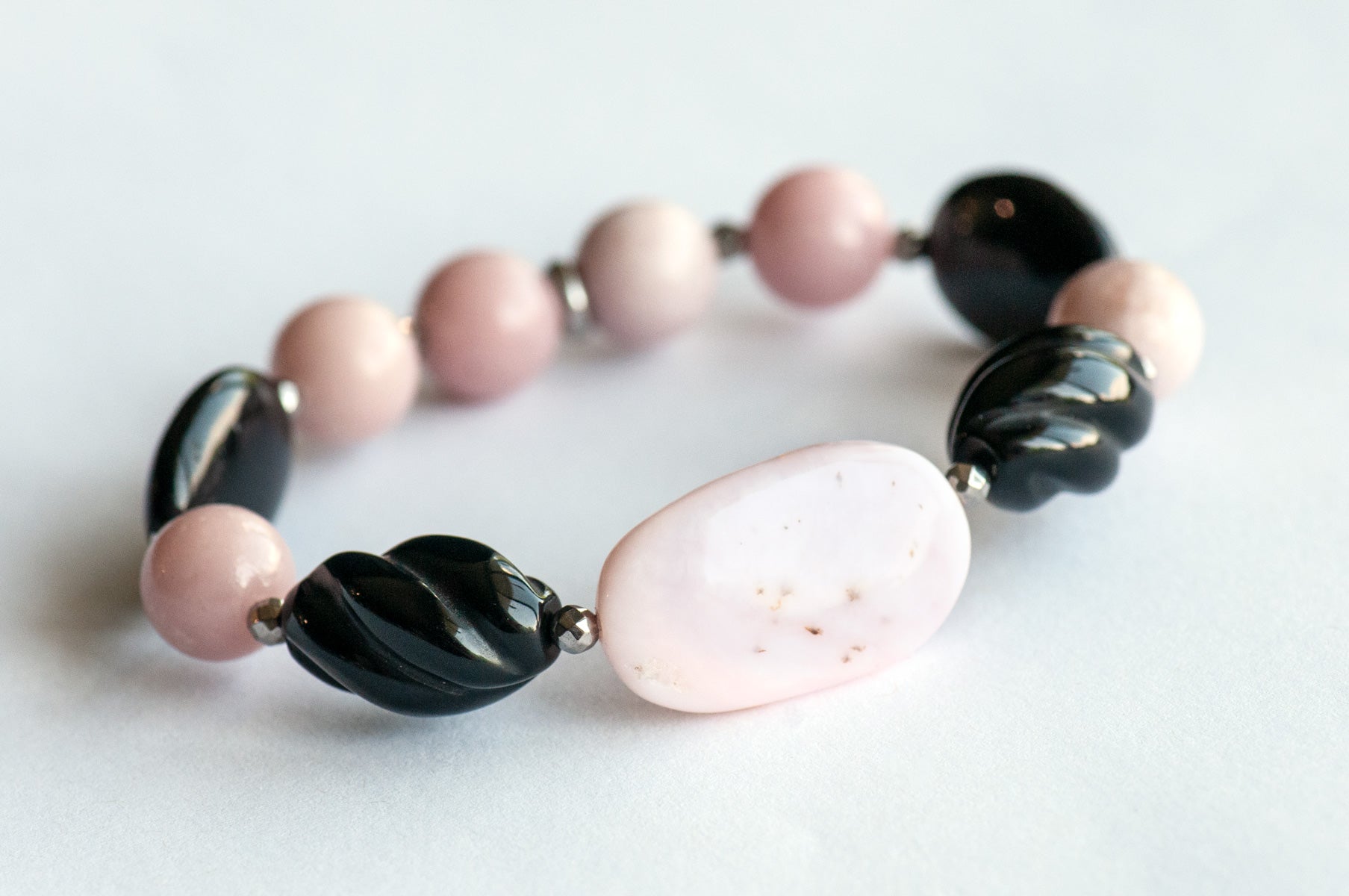 Close-up of Pink Opal and Black Onyx Beads in Bracelet Set