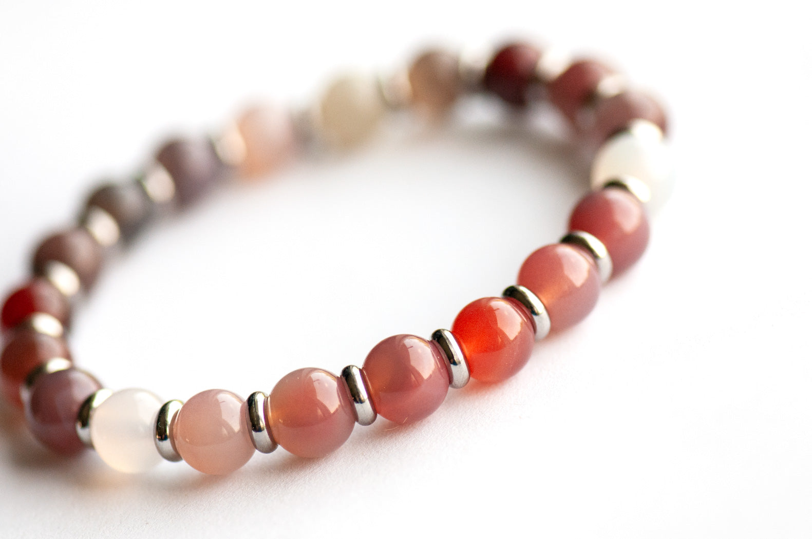 Phantom Agate Ombre bracelet in pink and grey gradient with stainless steel spacers