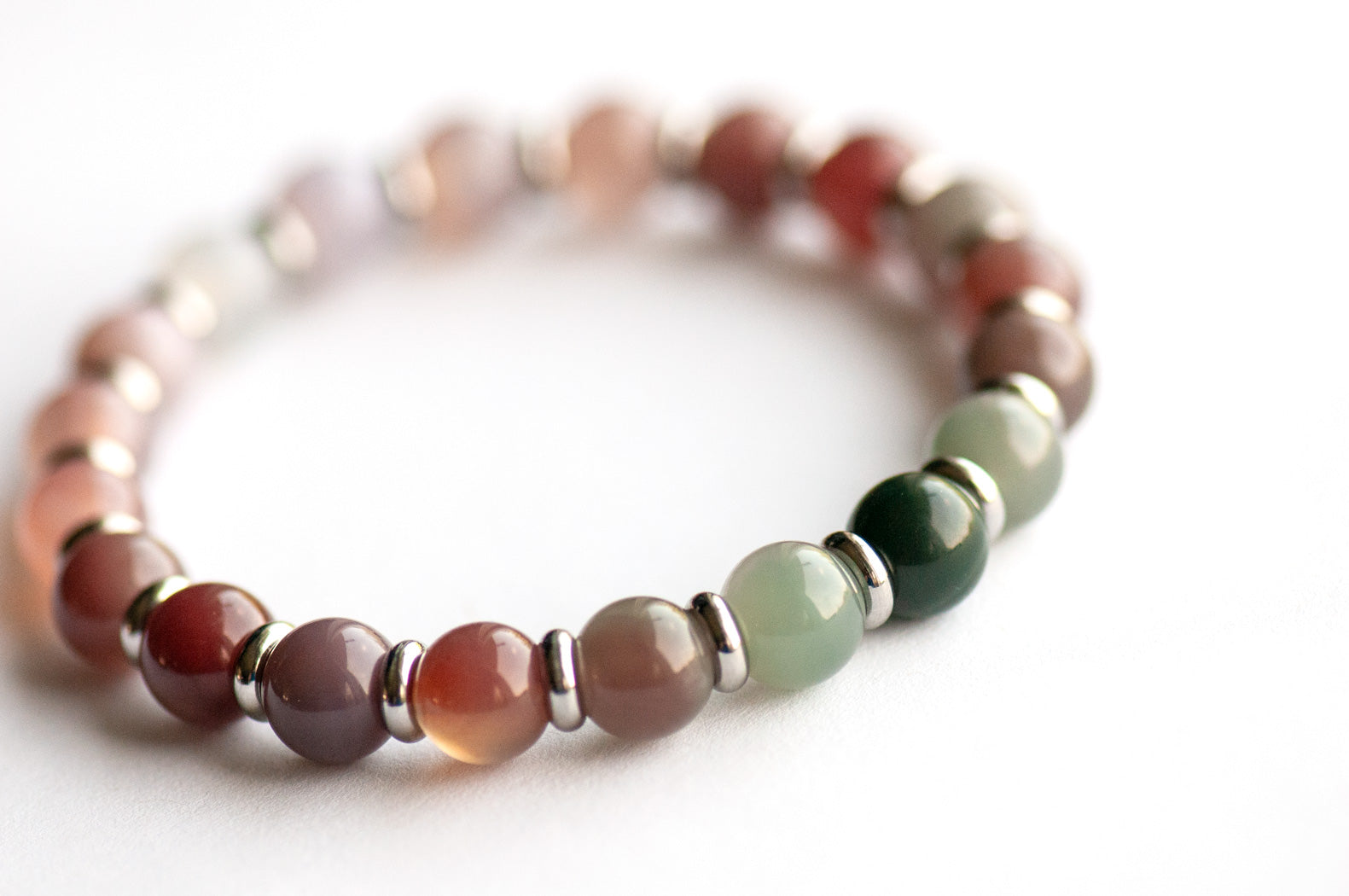 Phantom Agate Ombre bracelet in pink and green gradient with stainless steel spacers