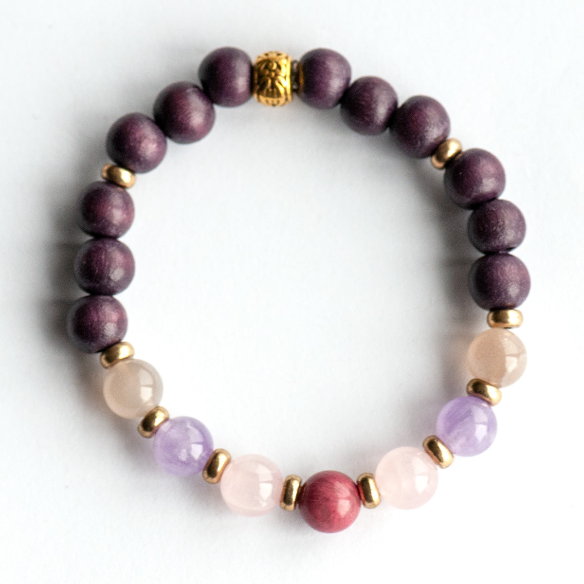 Fierce Grace bracelet featuring Rhodonite, Rose Quartz, Amethyst, and Moonstone gemstones on white background