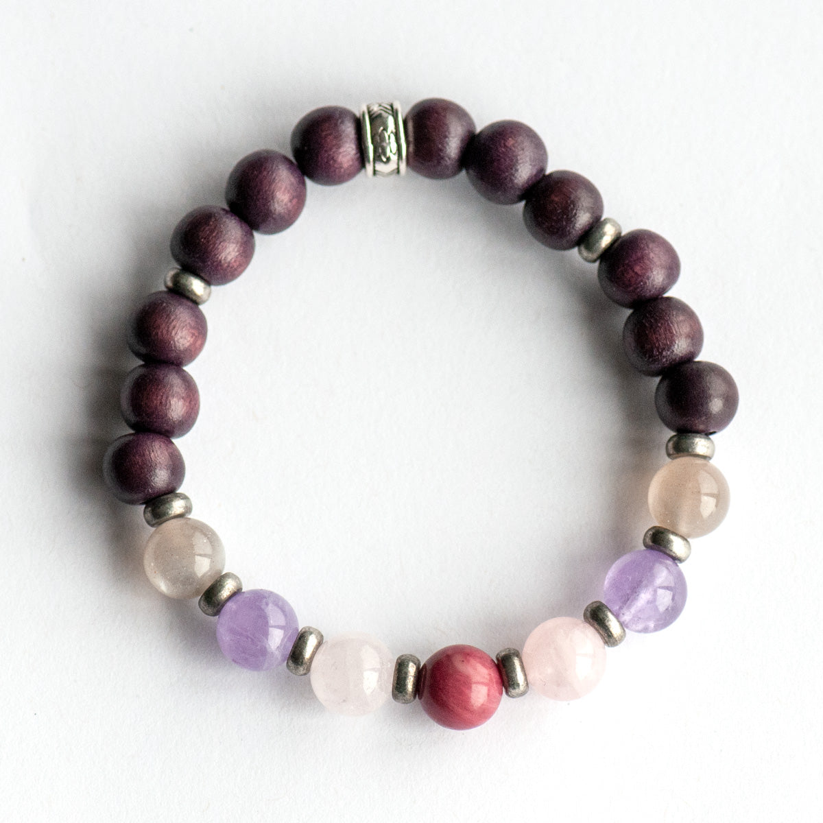 Fierce Grace bracelet featuring Rhodonite, Rose Quartz, Amethyst, and Moonstone gemstones on white background