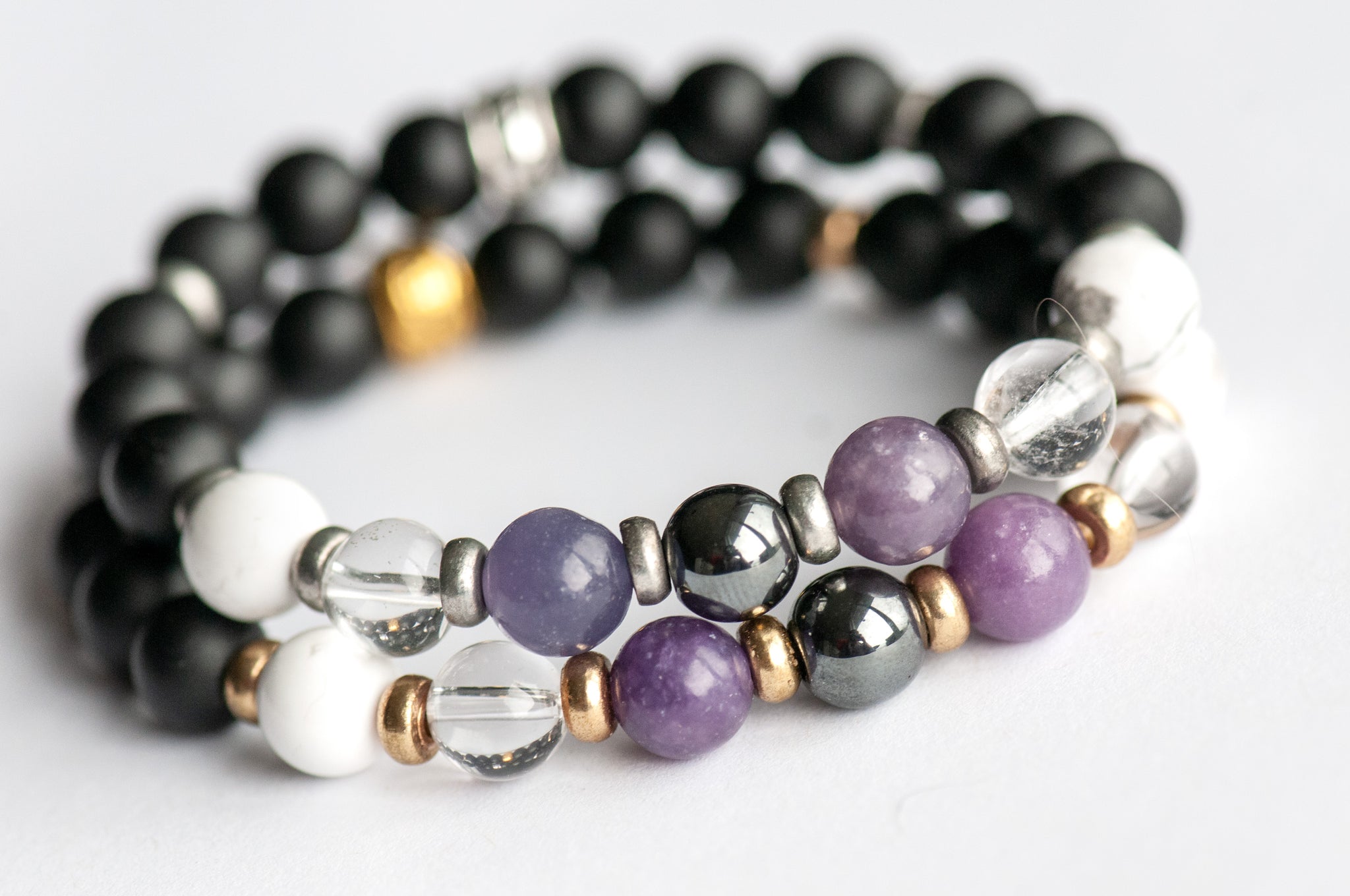 Fierce Slumber bracelet with Hematite, Lepidolite, Howlite, and Frosted Black Agate on white background available with gold or silver accents