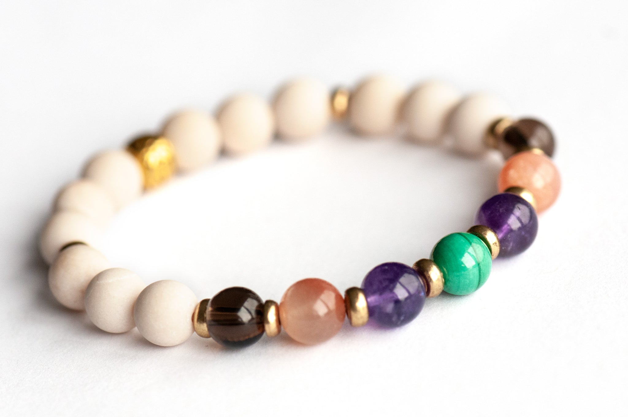 Fierce Ease bracelet with Malachite, Amethyst, Moonstone, and Smoky Quartz on white background
