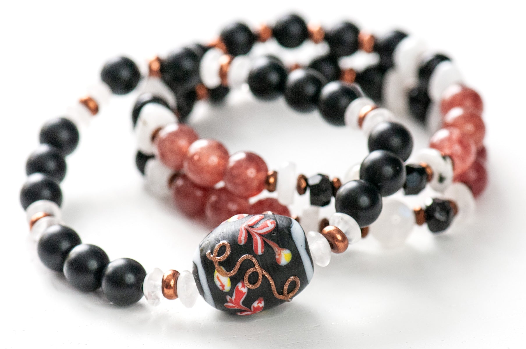 Kyoto at night inspired bracelet stack with sakura colours, moonstone rainbow flash, and copper details