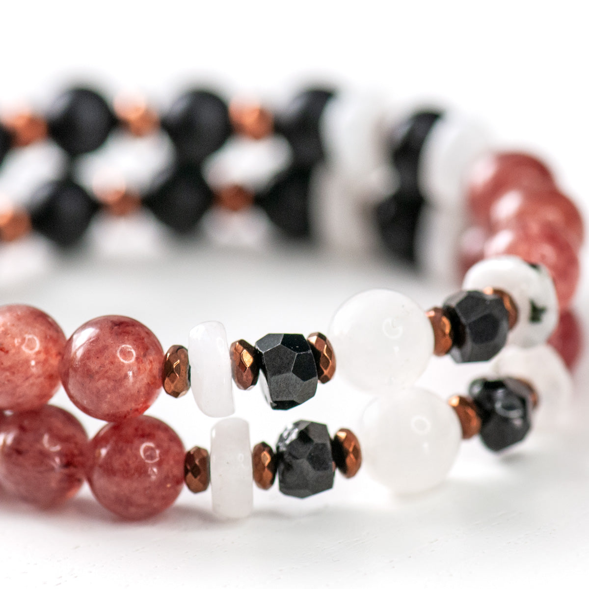 Handmade Voyage to Kyoto jewellery featuring strawberry quartz, moonstone, and matte black agate