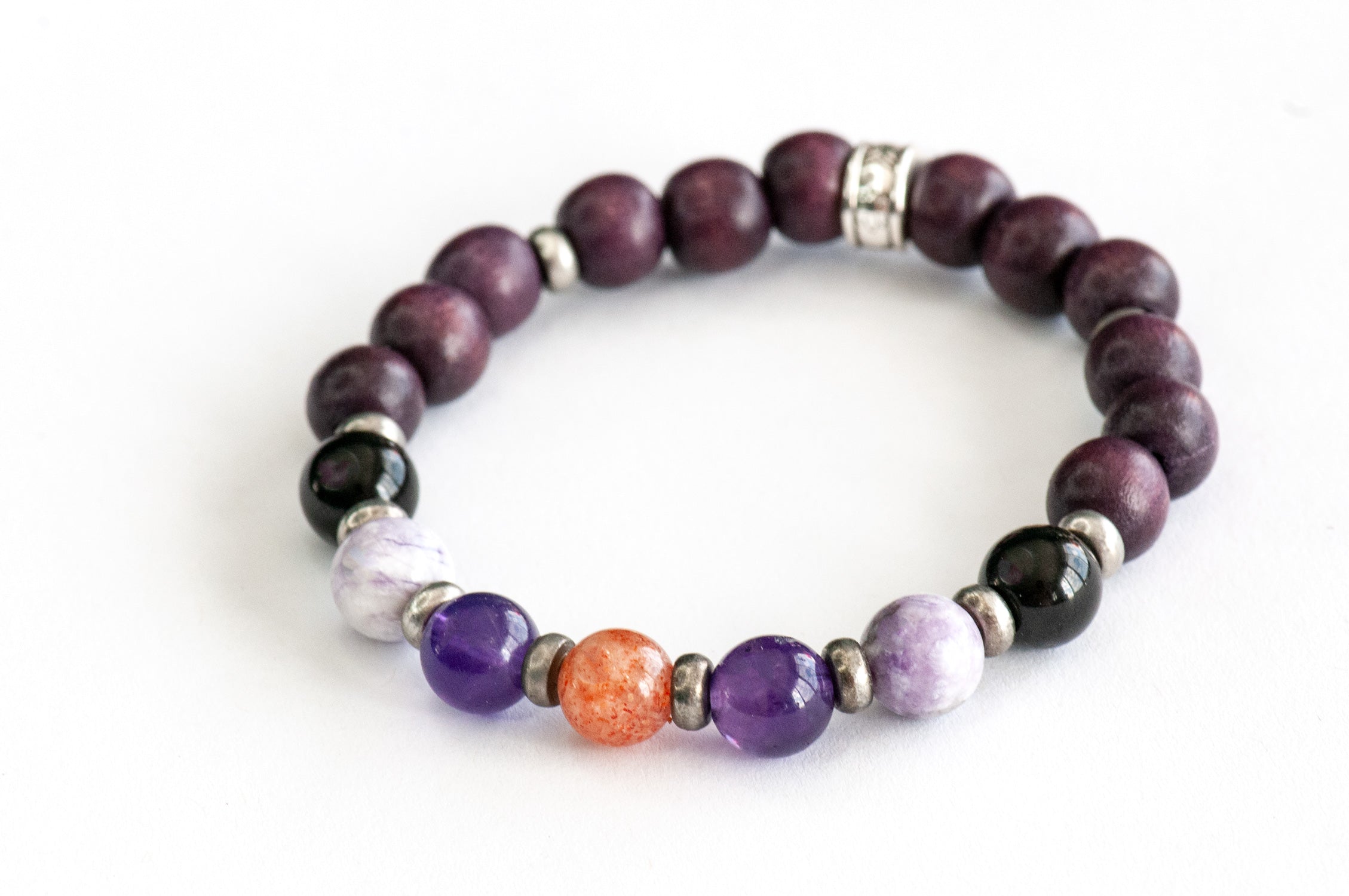 Amethyst, Tiffany Jasper, and black flower tourmaline beads in Fierce Safe Passage bracelet