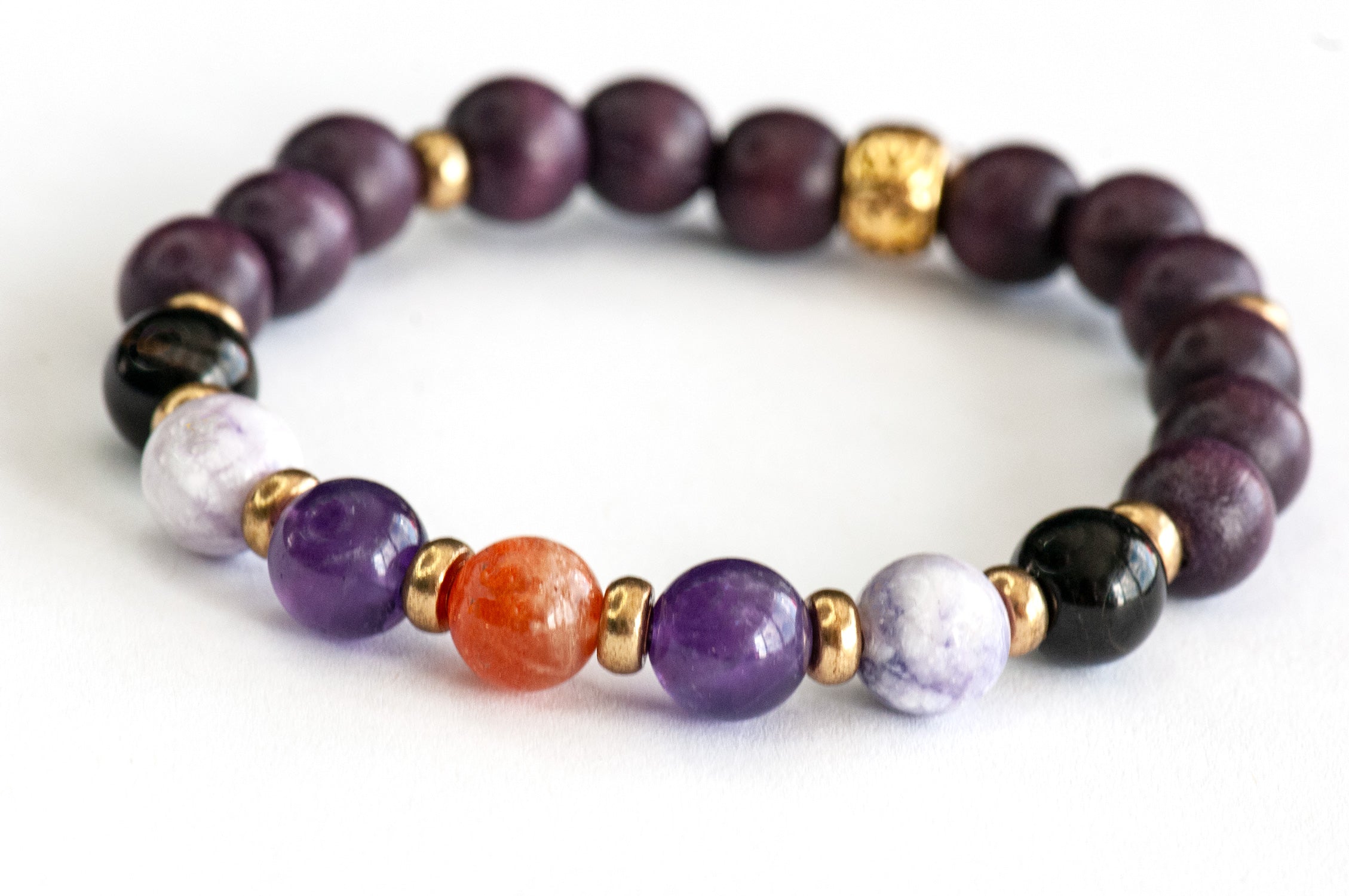 Golden sunstone centre bead with coppery sparkle in Fierce Safe Passage crystal bracelet