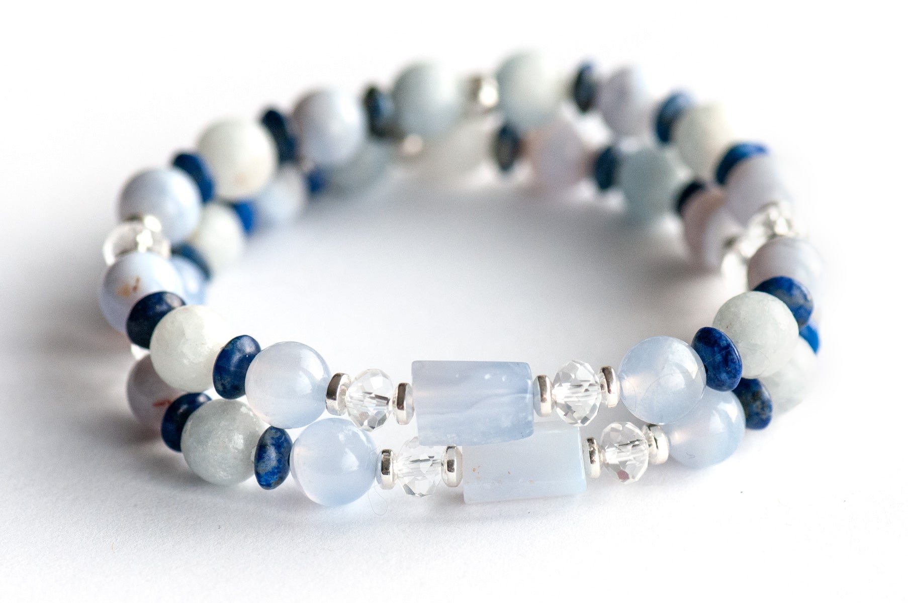 Handmade supporting bracelets featuring AAA-grade blue lace agate tubes and rounds with celestite, lapis lazuli accents, and crystal quartz rondelles