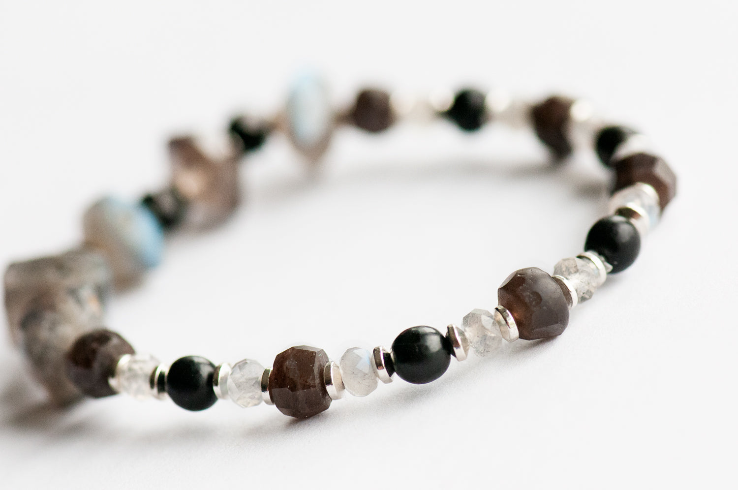 traditional and red labradorite and horn beads in our True Colours allyship bracelet