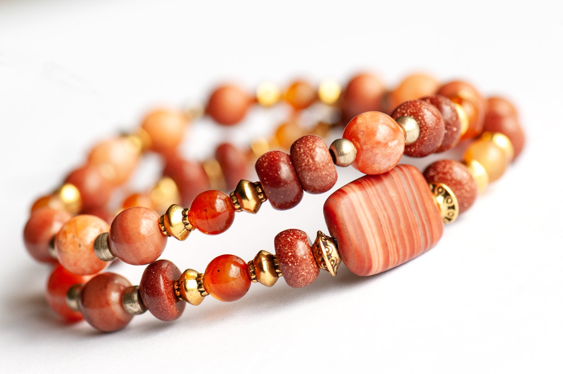 Marigold Bracelet Set: Tiger Jasper, Carnelian & Red Malachite celebrate October's birth flower — fiery warmth and resilience in rust, gold, and ember tones.

