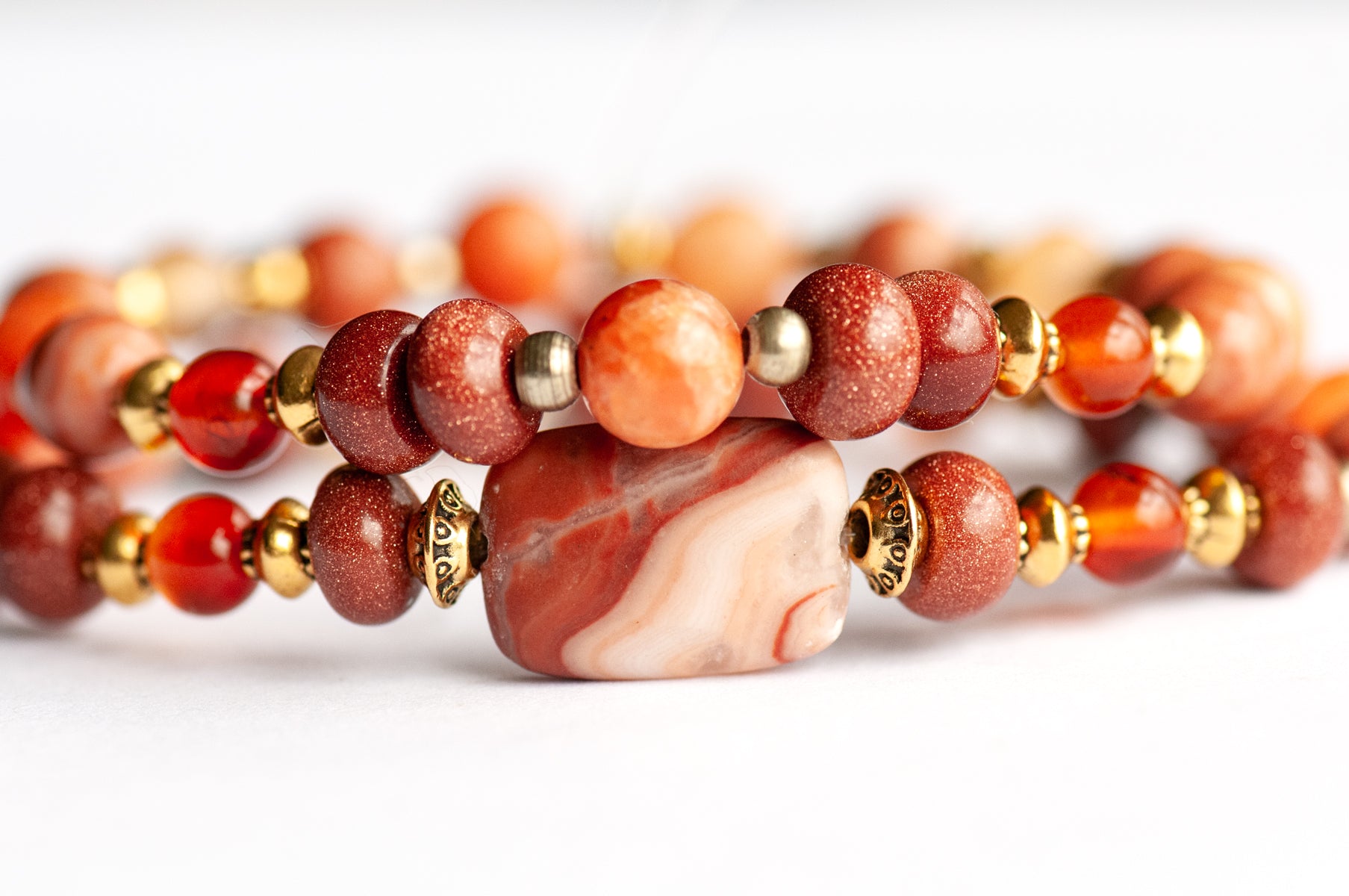 Marigold Bracelet Set: Tiger Jasper, Carnelian & Red Malachite celebrate October's birth flower — fiery warmth and resilience in rust, gold, and ember tones.
