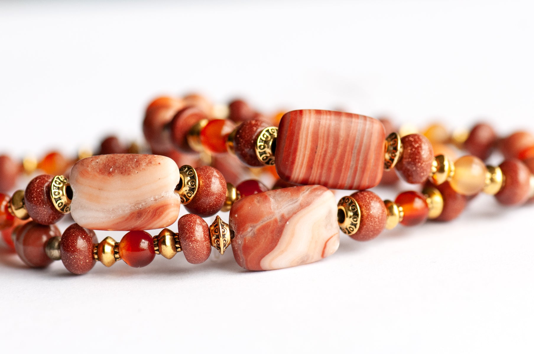Marigold Bracelet Set: Tiger Jasper, Carnelian & Red Malachite celebrate October's birth flower — fiery warmth and resilience in rust, gold, and ember tones.
