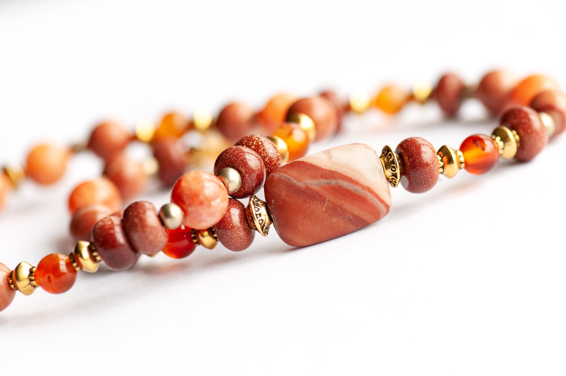 Marigold Bracelet Set: Tiger Jasper, Carnelian & Red Malachite celebrate October's birth flower — fiery warmth and resilience in rust, gold, and ember tones.
