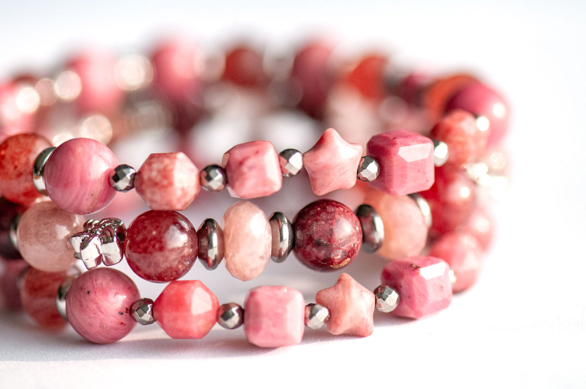 Carnation January birth flower bracelet set — side view, triple stack showing full layered effect in deep wine, berry and soft blush tones