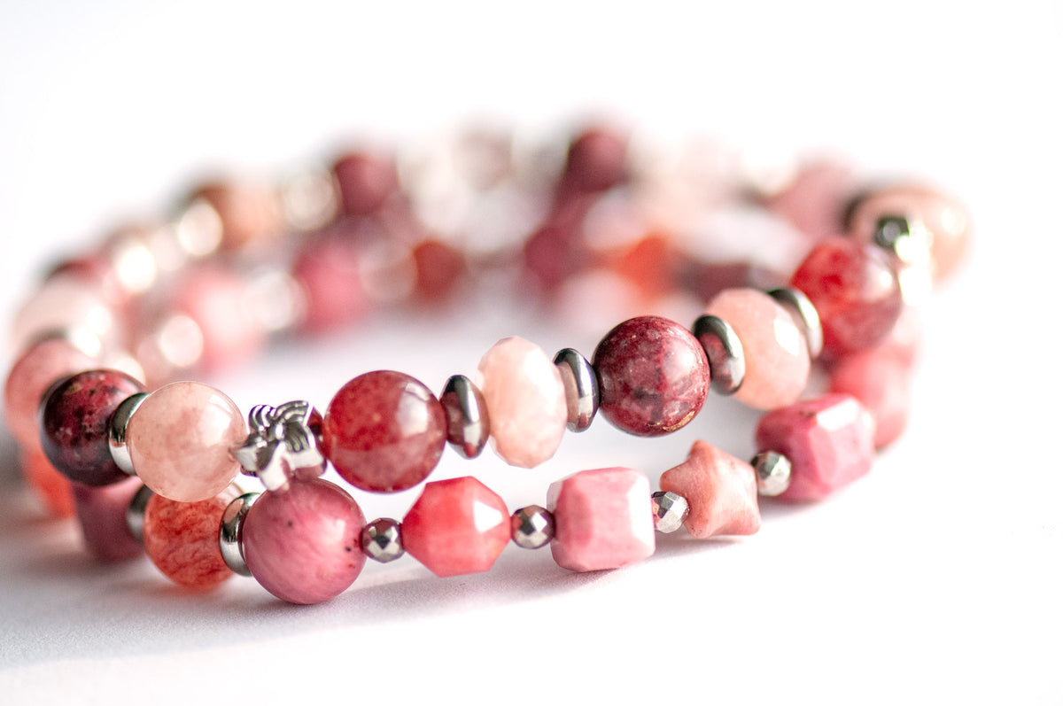 Carnation January birth flower bracelet set — front view, two bracelets featuring deep wine Eudialyte, Strawberry Quartz and Berry Quartz rounds in rich berry tones