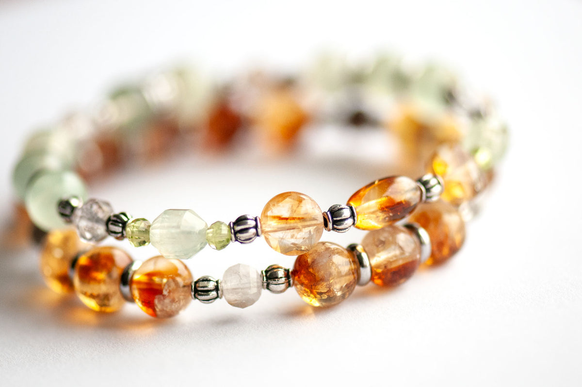 Side view of Daffodil gemstone bracelet set showing a Citrine rice bead, faceted Citrine coins and green Prehnite Energy Prisms