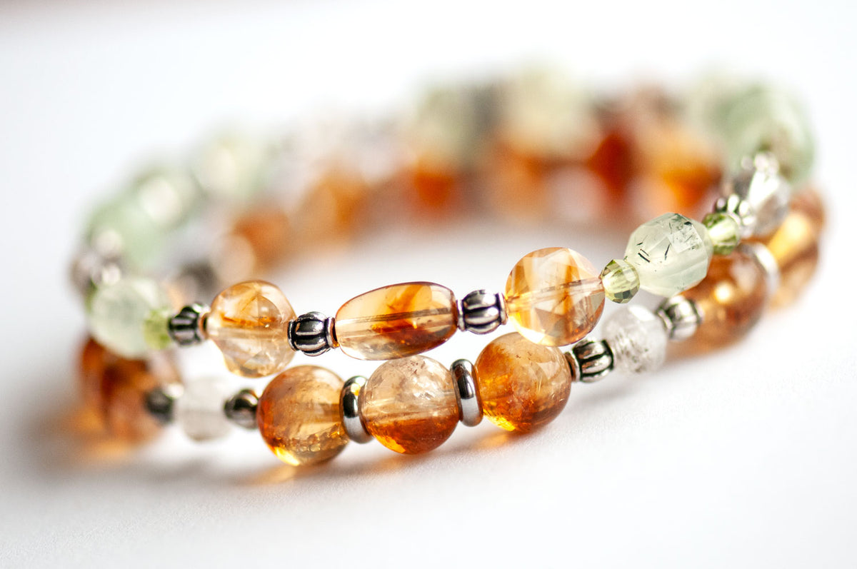 Side view of Daffodil gemstone bracelet set showing a Citrine rice bead, faceted Citrine coins and green Prehnite Energy Prisms