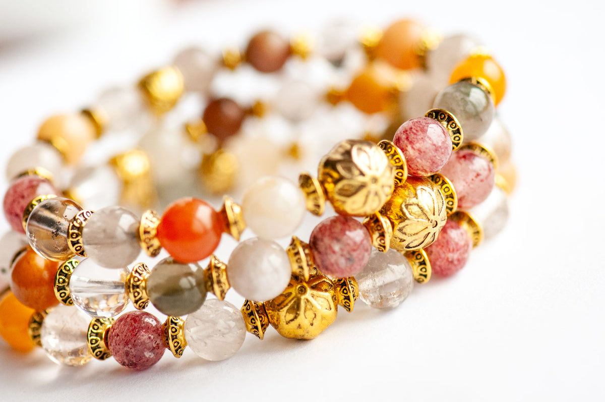Two Fierce Multitude - Lodalite Quartz bracelets made of multicolored stone beads and antique golden-plated spacers.