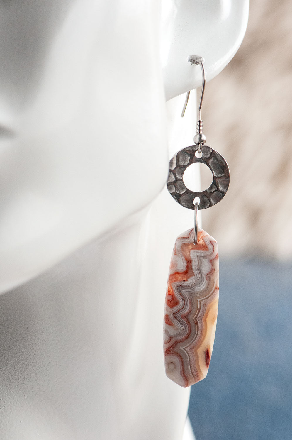 Laguna Lace Agate earrings worn on the ear, showing their 7.5 cm total length