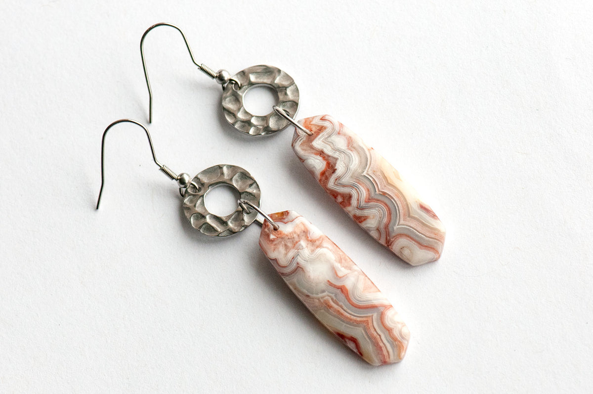 Close-up of a 12 × 38 mm Laguna Lace Agate oval point showing its intricate red and white banding