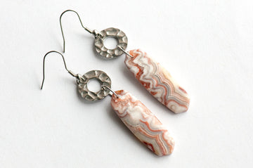 Close-up of a 12 × 38 mm Laguna Lace Agate oval point showing its intricate red and white banding