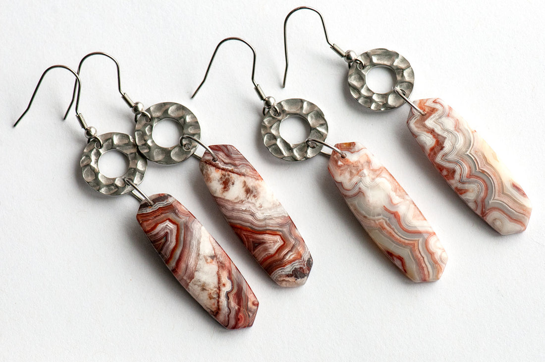 Close-up of a 12 × 38 mm Laguna Lace Agate oval point showing its intricate red and white banding