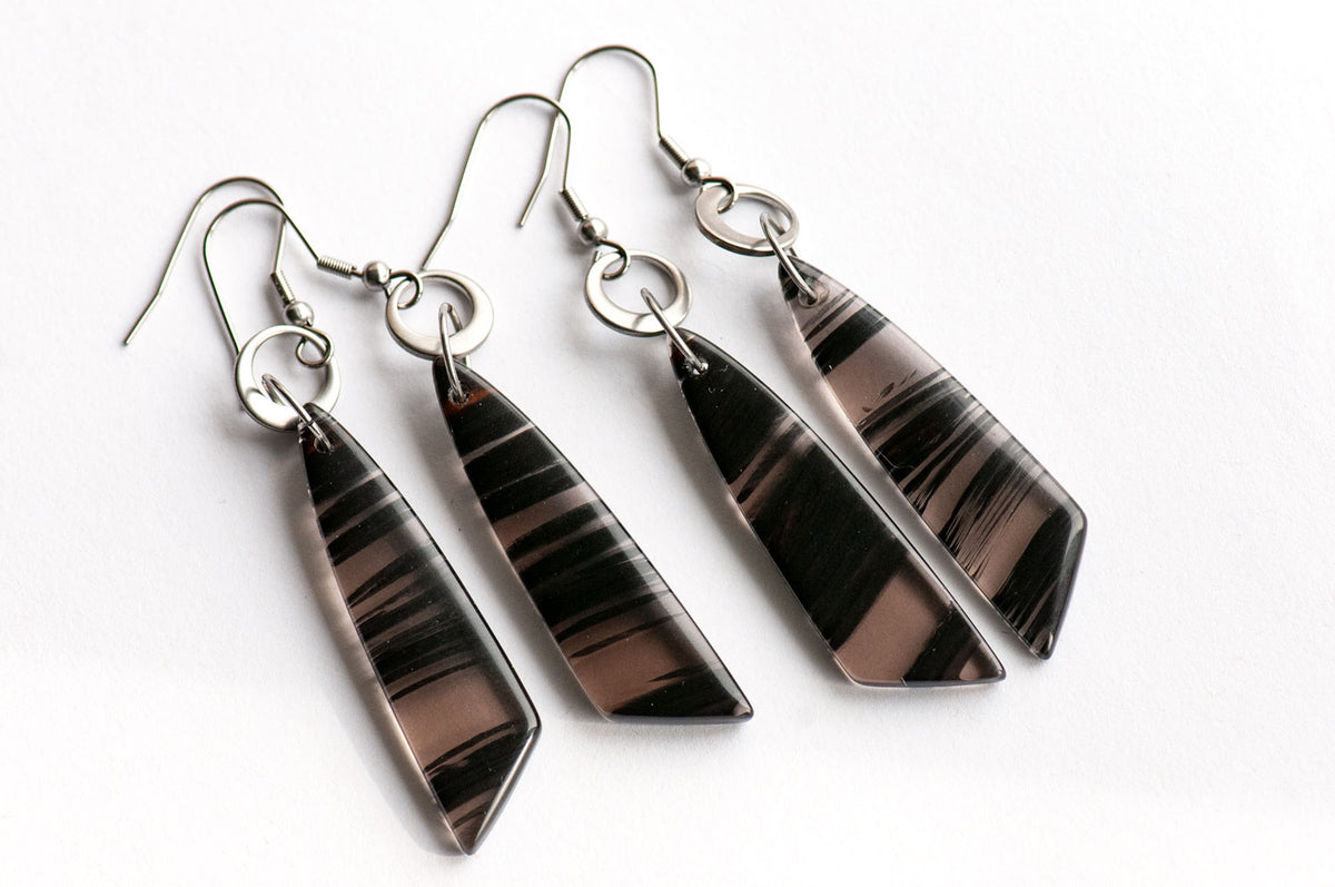 Ice Obsidian wing drop earrings on asymmetrical stainless steel rings, handmade in New Brunswick, Canada