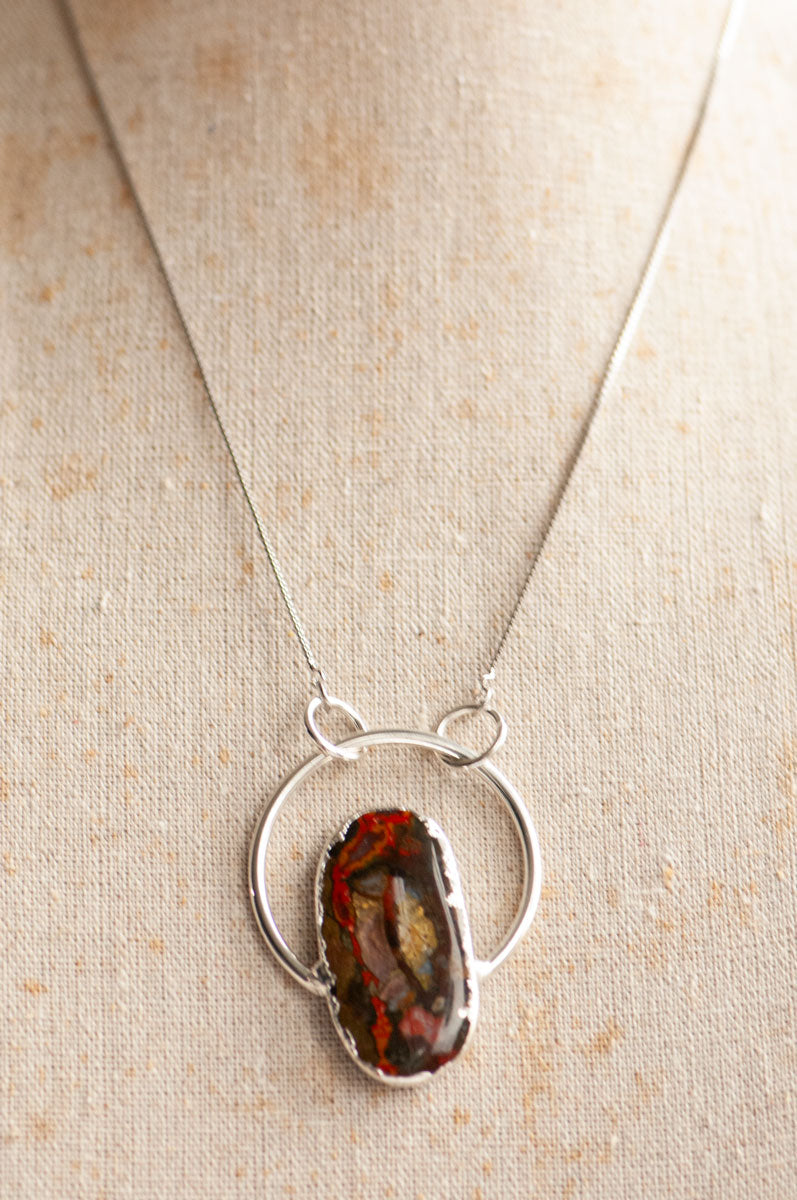 Moroccan Seam Agate hoop pendant necklace worn on a linen bust at a shorter length.