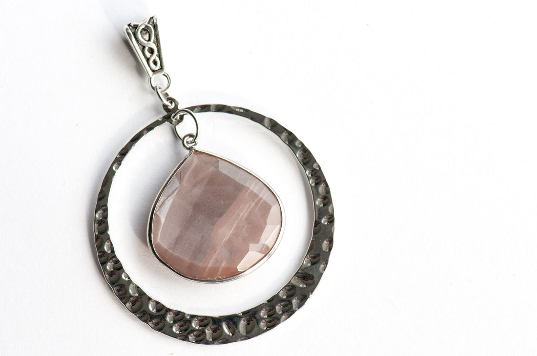 Three Mocha Lynx pendants, each a faceted Chocolate Moonstone pear in a silver bezel with a hammered silver ring and infinity-motif bail.