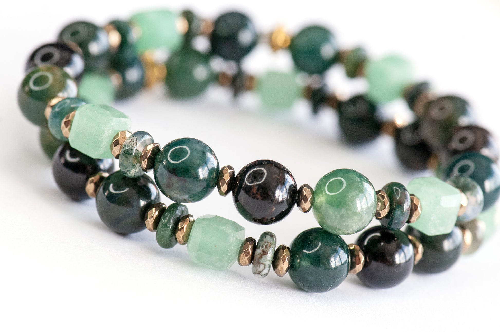 Fierce Earth supporting bracelets with Moss Agate, Black Flower Tourmaline, and Green Aventurine accents
