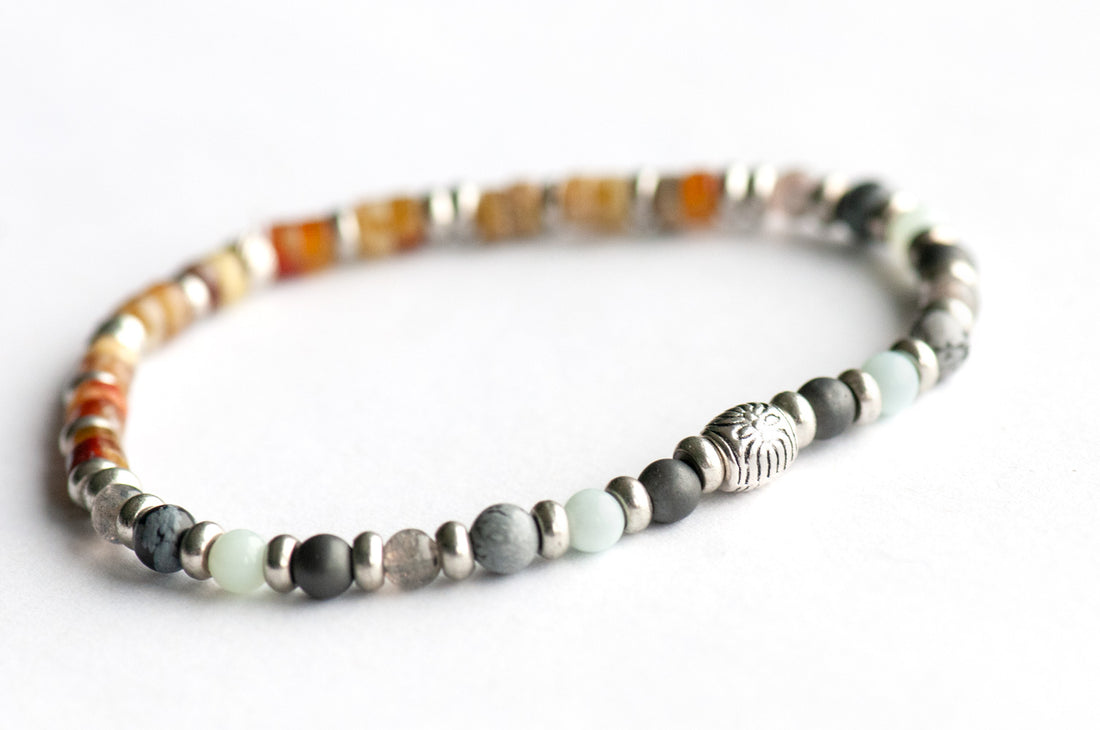 Nunavut Lynx Bracelet Set – Two handmade gemstone bracelets featuring Fire Serpentine, Dragon Blood Jasper, and customizable charm options