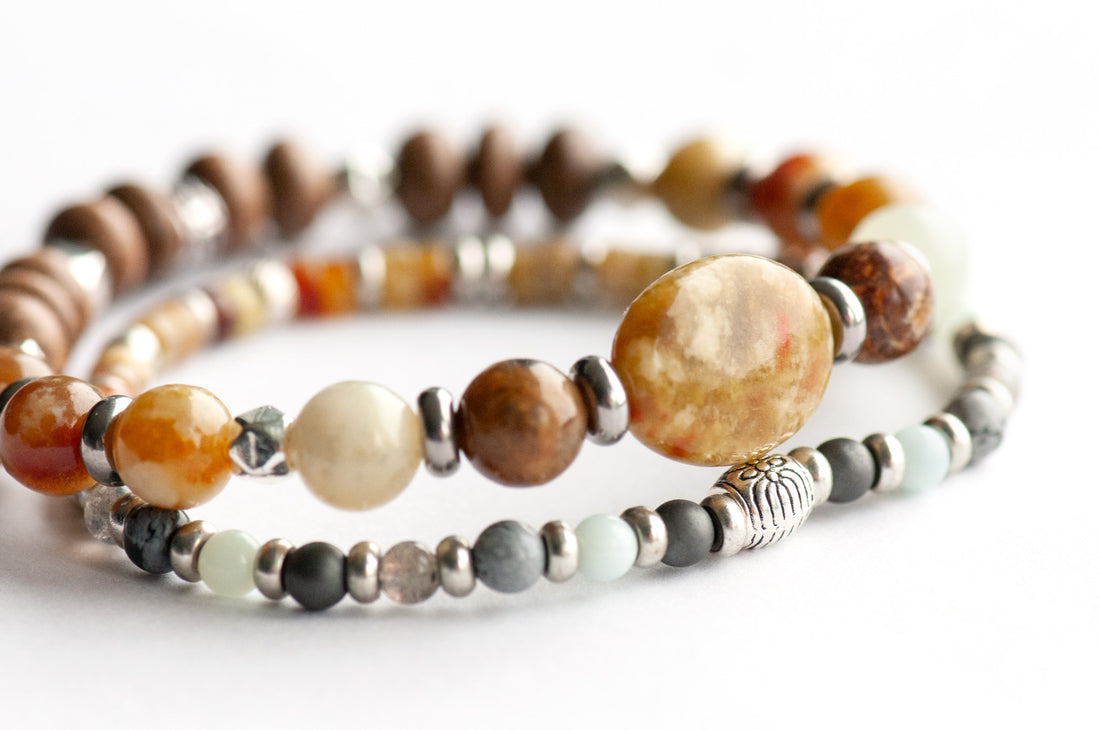 Nunavut Lynx Bracelet Set – Two handmade gemstone bracelets featuring Fire Serpentine, Dragon Blood Jasper, and customizable charm options