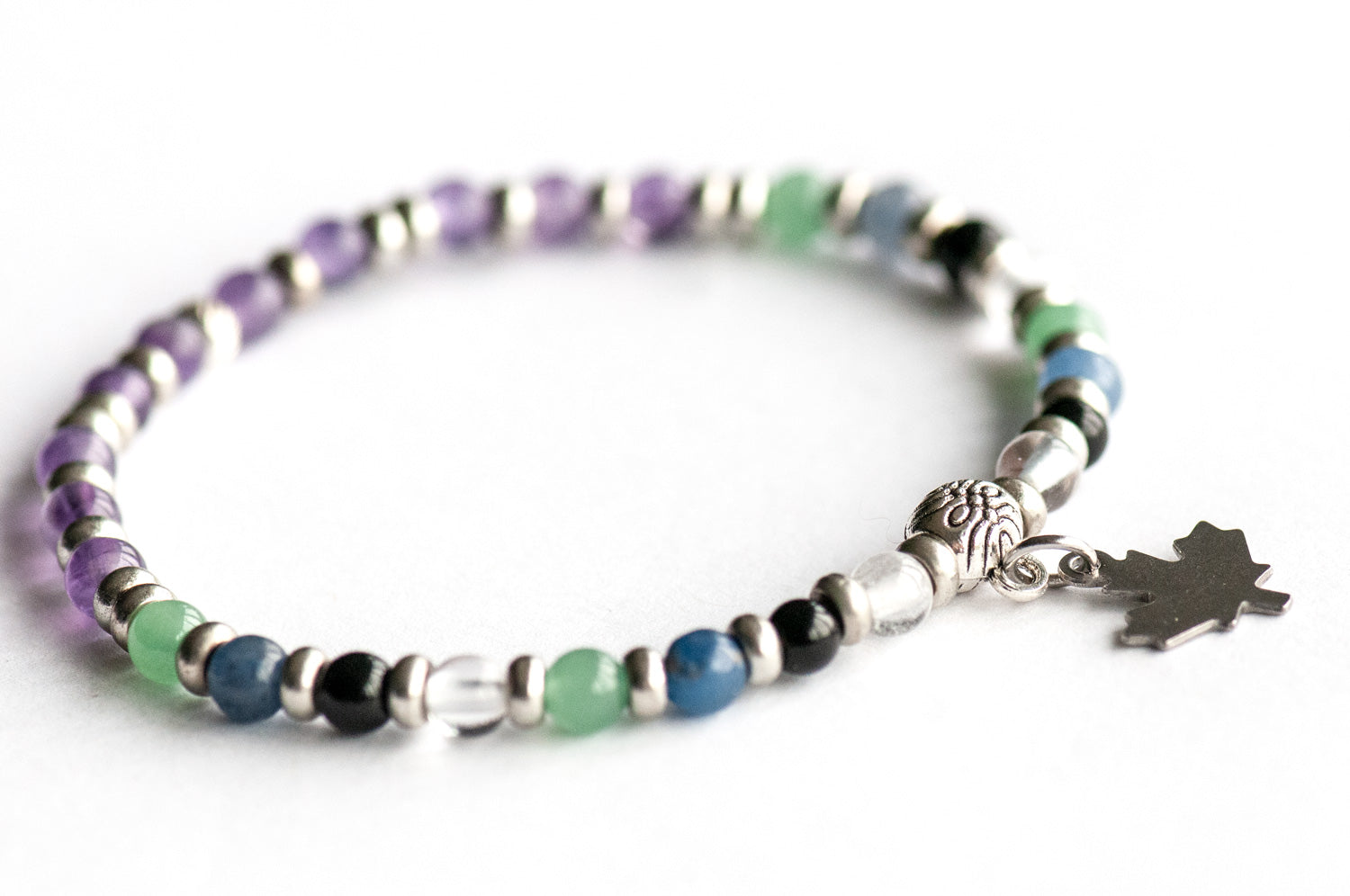 Supporting bracelet from Ontario Lynx Set – 4mm stones with charm, including Green and Blue Aventurine, Clear Quartz, Black Tourmaline, and Amethyst