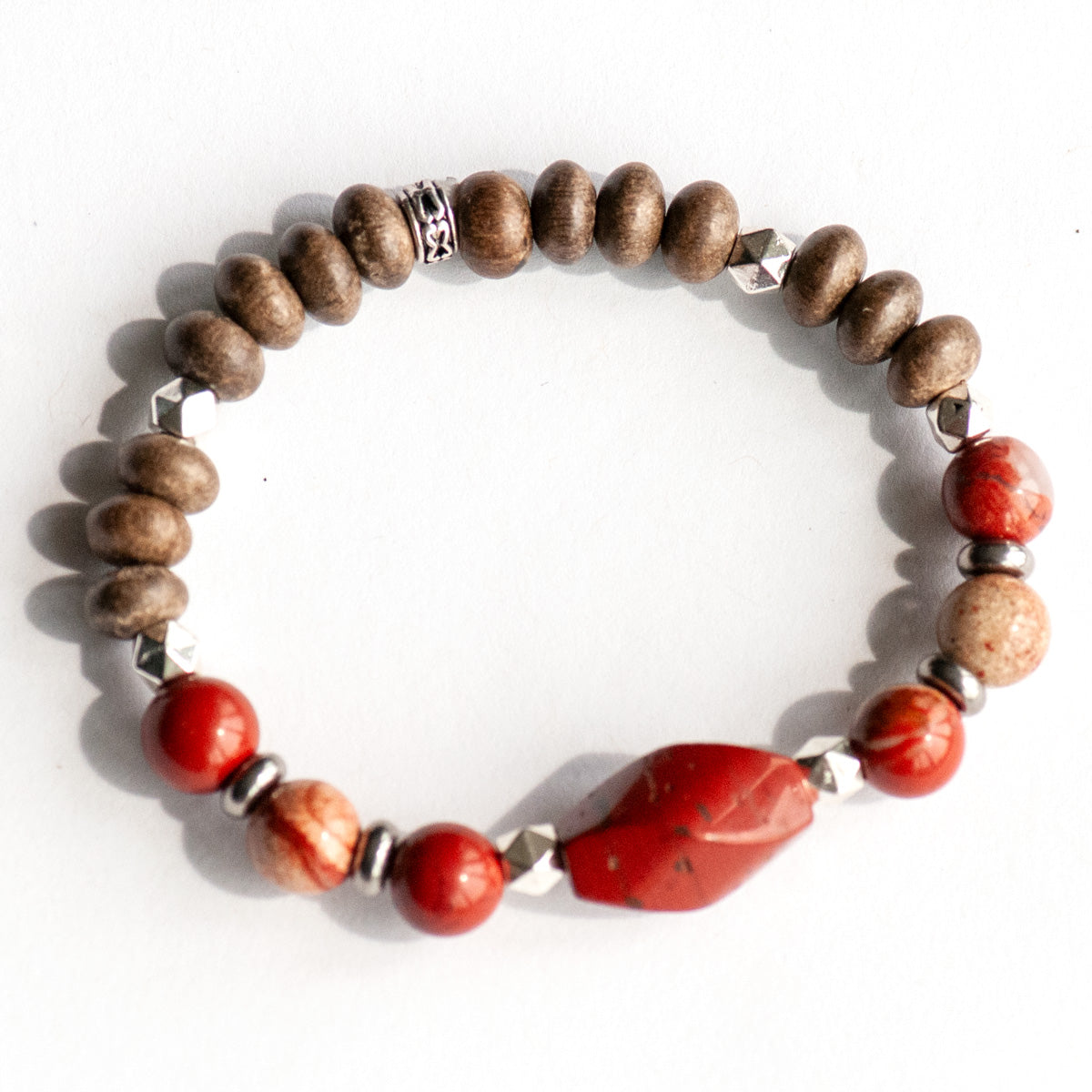 Feature bracelet from Prince Edward Island Lynx Set – Red Jasper twist bead with White Lace Red Jasper rounds, wood beads, and silver spacers