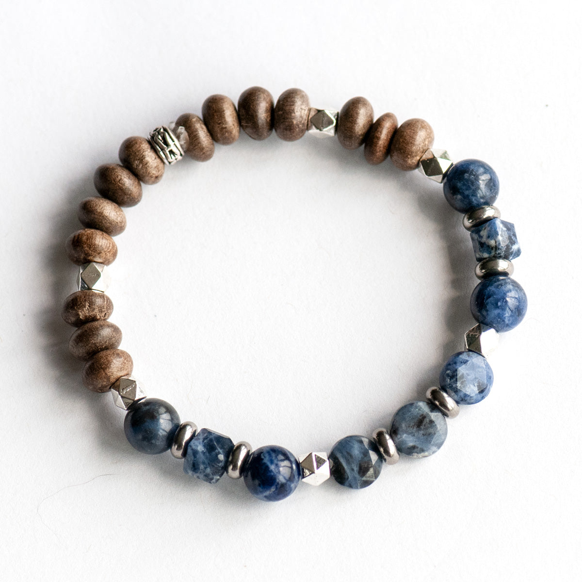 Feature bracelet from Quebec Lynx Set – Sodalite star-cut coins, cubes, and A-grade rounds with grey wood beads and silver spacers