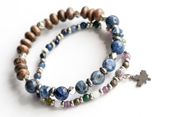 Quebec Lynx Bracelet Set – Two handmade gemstone bracelets featuring Sodalite, Pyrite, White Jade, and customizable charm options