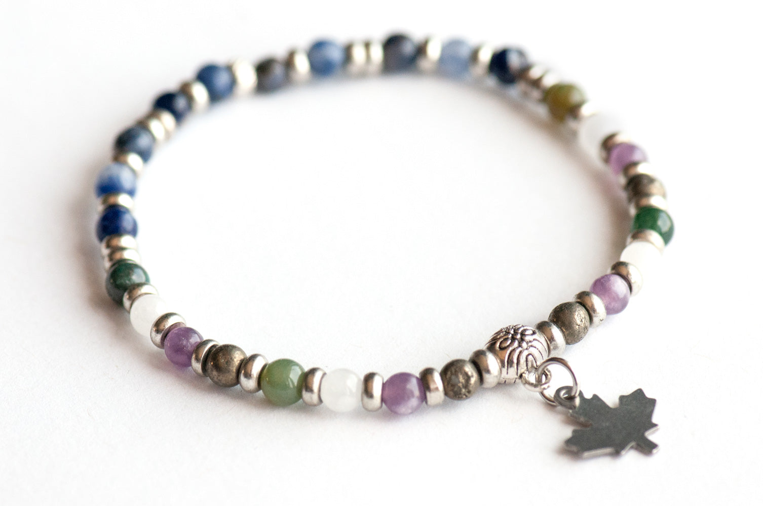 Supporting bracelet from Quebec Lynx Set – 4mm stones with charm, including Moss Agate, Pyrite, White Jade, Lepidolite, and Sodalite