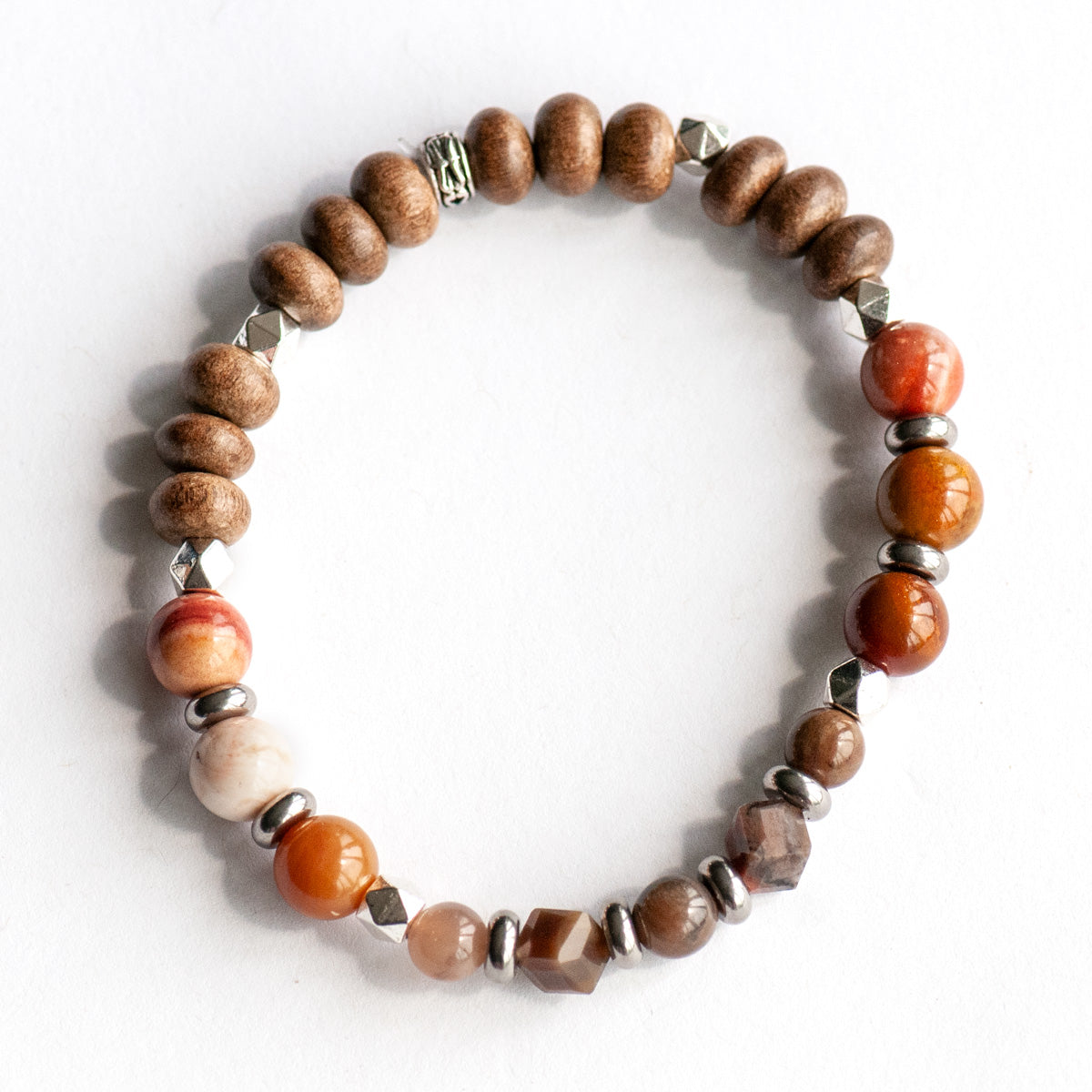 Feature bracelet from Saskatchewan Lynx Set – Petrified Wood Agate cubes and rounds in warm earth tones with grey wood beads and silver spacers