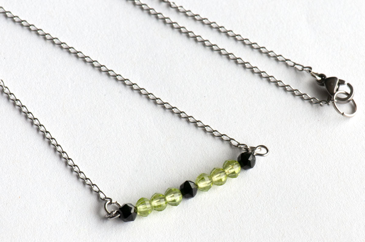 August birthstone necklace with peridot and spinel