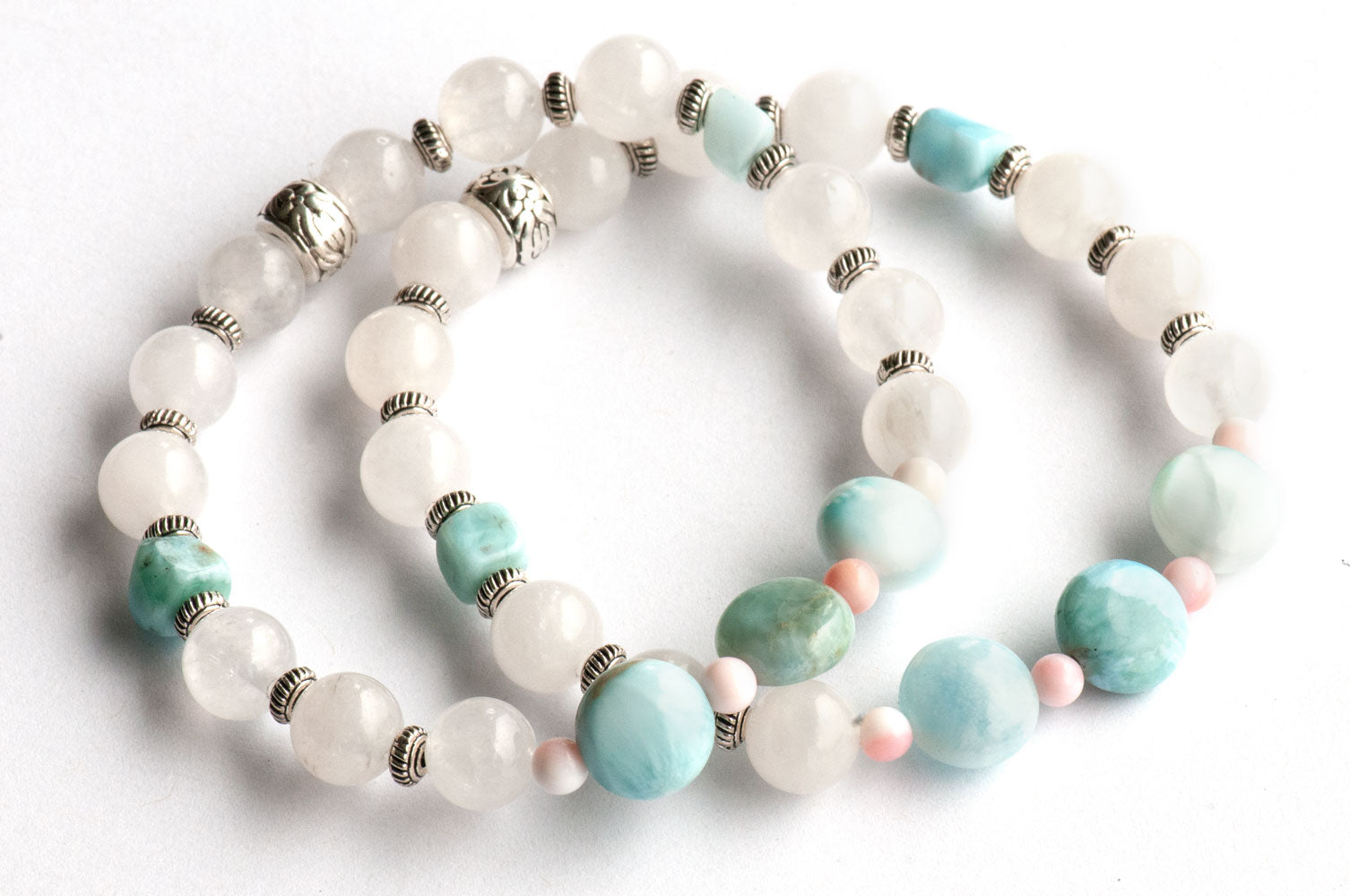 Handmade seaside bracelets with Larimar and Queen Conch Shell