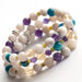 Handmade gemstone bracelet set made in Canada in white, purple, yellow, and blue.
