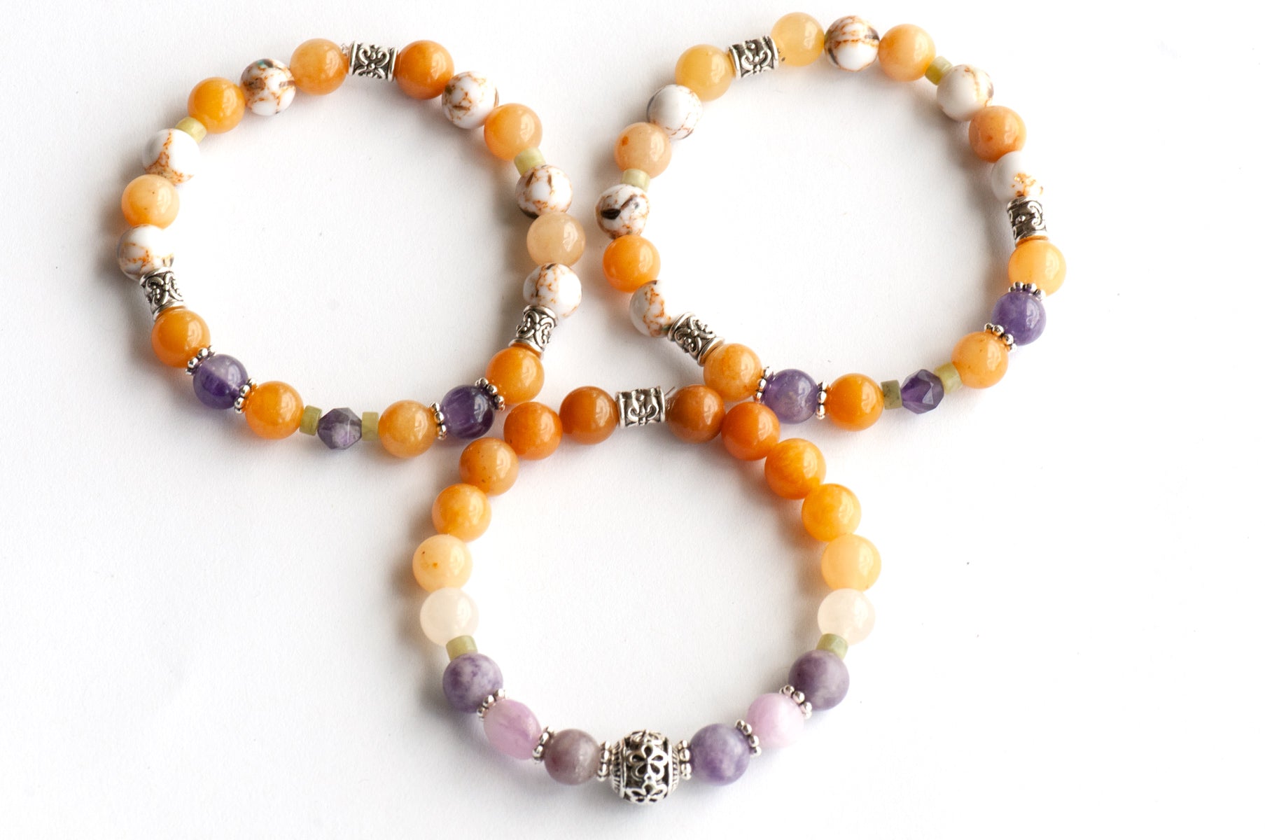 Lavender & Saffron gemstone bracelet handmade in New Brunswick Canada featuring Jade, Lepidolite, Kunzite and Amethyst