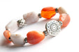 The Sunburst bracelet combines orange and polka dot chalcedony in a bold handmade bracelet