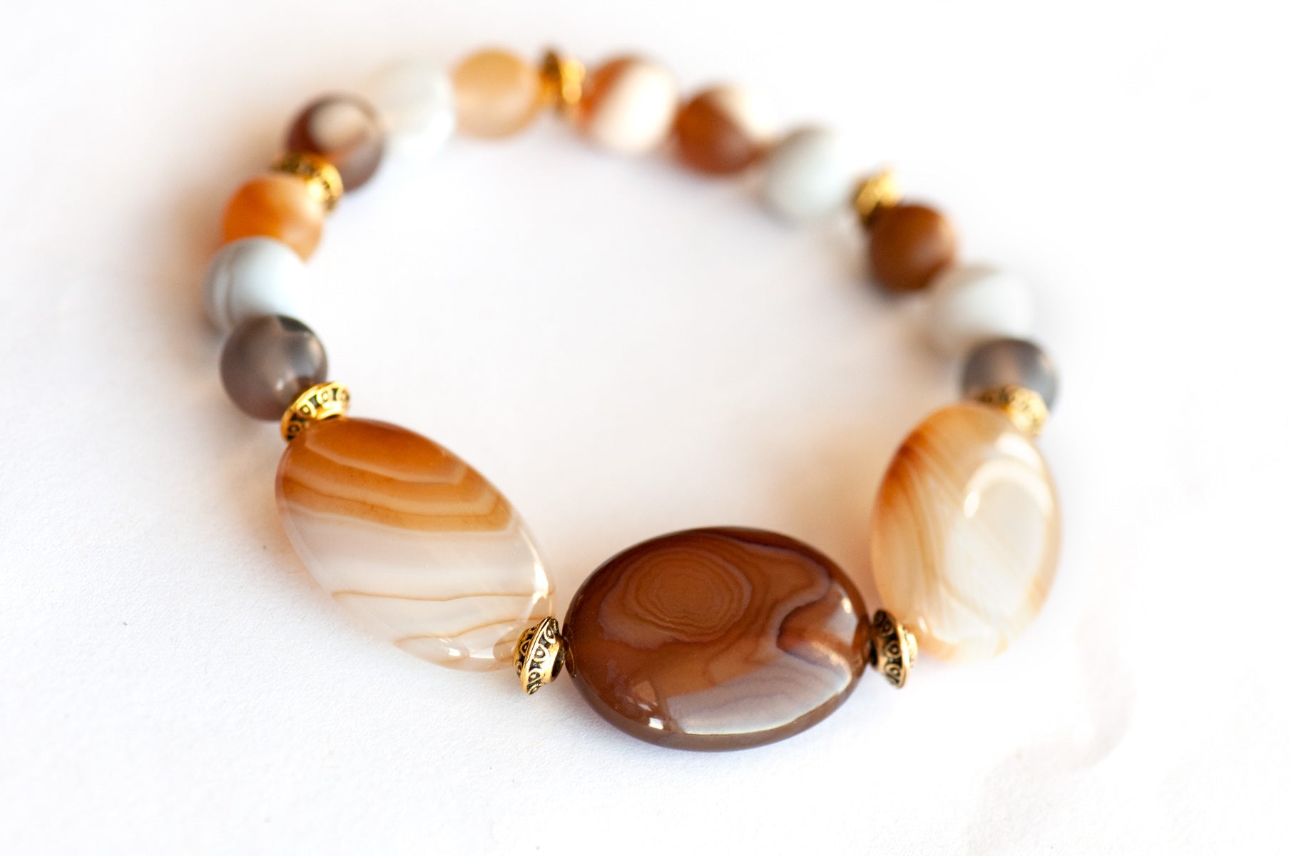 Natural banded Agate bracelet in caramel and brown with gold accents