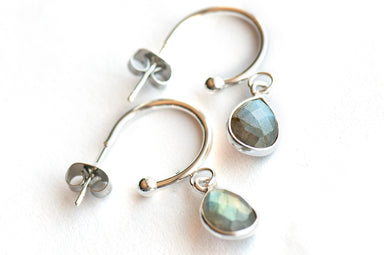 Stunning Sterling Silver bezel-faceted Labradorite drops dangle from silver-plated stainless steel half hoop stud earrings. 