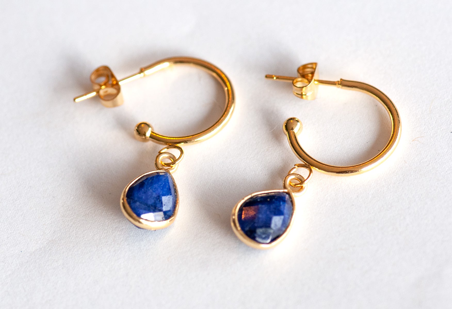 Sapphire earrings with gold hoops for September birthstone
